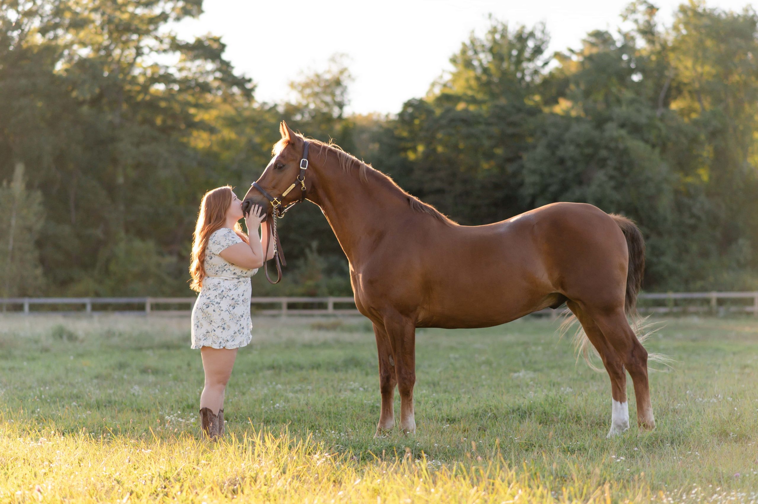Equestrian photography with a horse rider kissing her horse