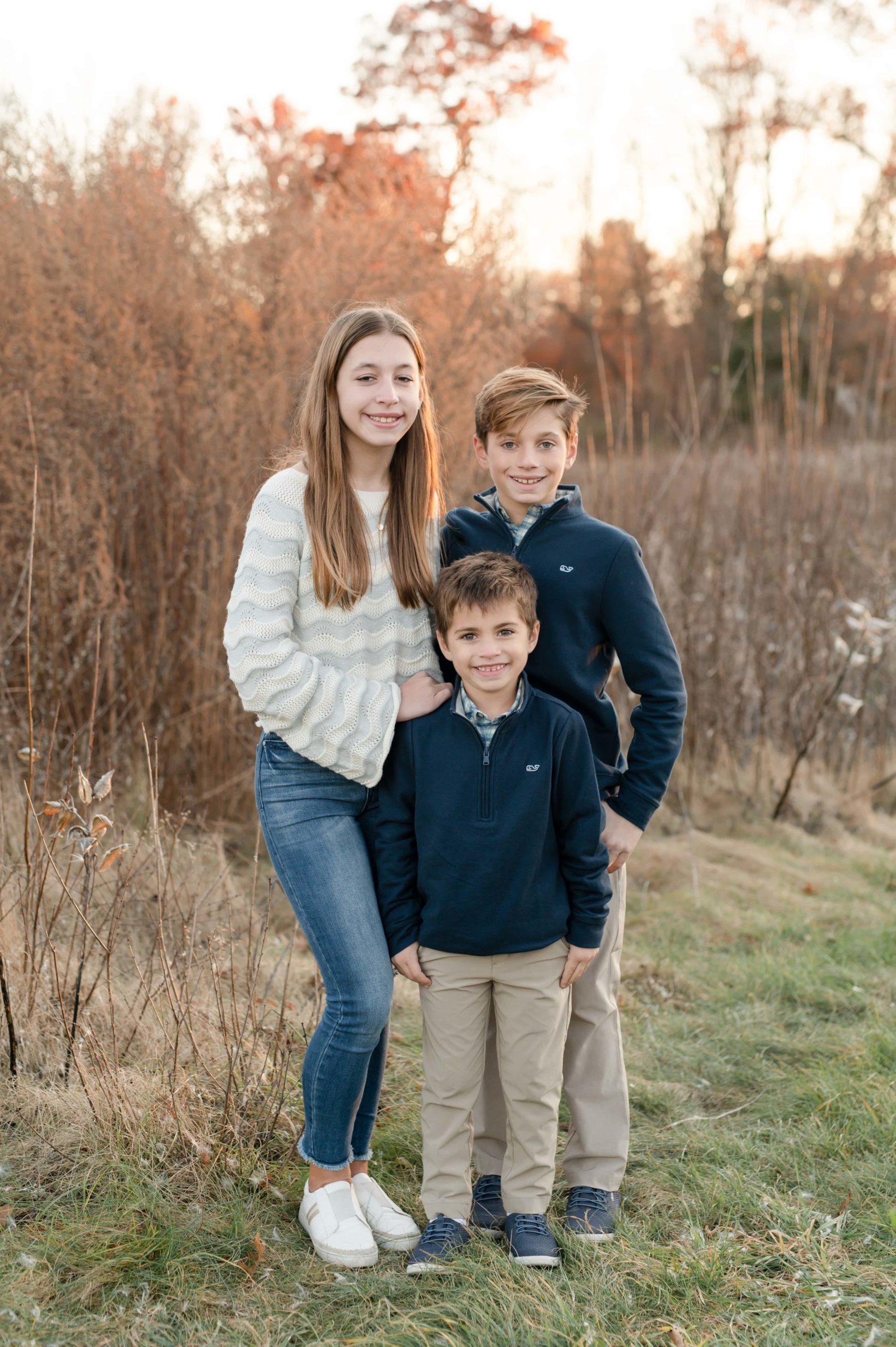 Sibling photos in fall with matching navy outfits