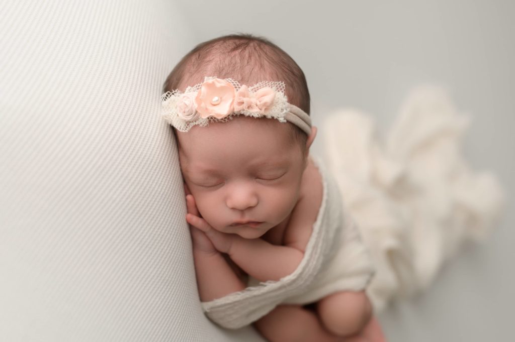 Newborn photos with a floral headband